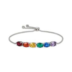 A spectrum of hues is displayed in this simple and stunning rainbow bolo bracelet. Sterling silver The arrangement of oval-cut stones includes a lab-created ruby; a lab-created blue spinel; a lab-created emerald; and one each of yellow, orange, and pink lab-created sapphires The wheat chain and sliding clasp adjust to 9.5 inches Adjustable Rainbow Gemstone Jewelry, Rainbow Colored Oval Jewelry, Elegant Adjustable Rainbow Bracelet, Adjustable Oval Multicolor Bracelets, Adjustable Multicolor Oval Bracelets, Blue Spinel, Bolo Bracelet, Lab Created Emerald, Orange And Pink