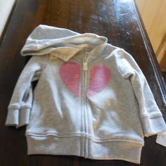 This Is An Adorable Little Carter's Gray Sweat Hoodie With A Front Zipper Decorated With A Pink Sequin Heart. It Is A Size 12m And Brand New With Tags. Cotton Playtime Hoodie Outerwear, Cute Pink Hooded Jacket For Fall, Pink Hooded Tops For Playtime, Pink Hooded Top For Playtime, Cute Pink Long Sleeve Hooded Jacket, Pink Casual Hoodie For Playtime, Casual Pink Hoodie For Playtime, Cute Pink Hoodie For Playtime, Toddler Boys Sweatshirt