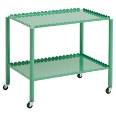 a green shelf with three shelves on each side and two wheels attached to the bottom