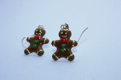 Adorable Gingerbread Earrings, Gingerbread Jewelry, Christmas Earrings, Christmas Jewelry, Food Earrings, Ginger Bread Man, Fun Earrings, Cookie Earrings, Gifts from Hawaii, Handmade on Maui by U'i Jewelry D E T A I L S * Style: Gingerbread Earrings * Earring Length: 1.5 inches (including ear wires). See last photo for size comparison * Material: Enamel and silver plated components. * Ear Wires: Silver plated Your newest pair of holiday earrings can be customized with your choice of ear wires, b Cute Christmas Festive Jewelry, Cute Christmas Gift Earrings, Cute Handmade Christmas Jewelry, Cute Handmade Jewelry For Christmas, Cute Handmade Christmas Earrings, Gingerbread Earrings, Man Earrings, Cookie Earrings, Food Earrings