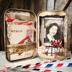 two tins with pictures and tape on them