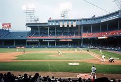 a baseball game in progress with the batter up to plate