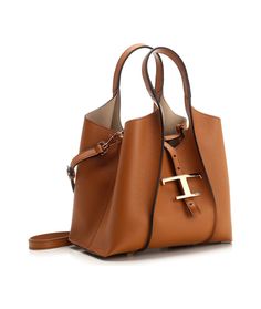 Tod's Timeless Logo Plaque Tote Bag | italist Luxury Calf Leather Shoulder Bag With Brass Hardware, Luxury Tote Bag With Gold-tone Hardware, Luxury Tote Satchel With Rolled Handles, Luxury Ralph Lauren Brown Bags, Taupe Handbags, Timeless Logo, Purse Trends, Bag Women Fashion, Timeless Wardrobe Staples