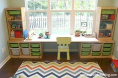 a child's desk and chair in a playroom