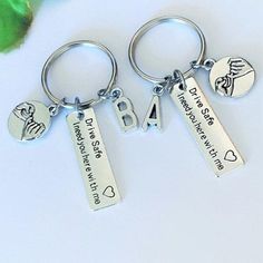 three key chains with two different charms on them