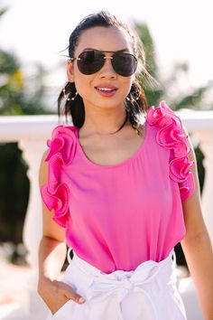 Introducing the Do Your Best Ruffled Blouse - the perfect addition to your summer wardrobe! With its ultra-feminine pink hue and ruffled detailing, this comfy-cute tank will have you looking sweet and chic! This blouse features a scoop neckline, ruffled sleeves, and a button keyhole back.  Material has no amount of stretch.Cindy is wearing the small. Feminine Summer Blouse With Ruffle Sleeves, Summer Feminine Blouse With Ruffle Sleeves, Feminine Summer Tank Top With Ruffle Hem, Summer Tank Top With Ruffled Hem And Straps, Summer Blouse With Ruffled Straps For Brunch, Pink Ruffled Straps Tank Top, Flirty Ruffled Tank Top For Summer, Chic Ruffled Tank Top For The Beach, Spring Tank Top With Ruffled Straps