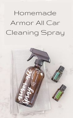 homemade armor all car cleaning spray on top of a white towel next to an empty bottle