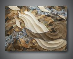 a painting made out of wood and stone with waves in the center, on a gray background