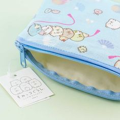 Store your kawaii accessories using this cute pouch covered in prints of the Sumikko Gurashi gang and uchiwa (traditional Japanese fan). It comes with a zipper closure so you can secure your items. A super kawaii pouch featuring Sumikko Gurashi characters and traditional Japanese fans Features a zipper closure Original licensed product from San-X Japan Kawaii Zipper Pouch Pencil Case For Daily Use, Kawaii Pencil Case With Zipper, Kawaii Pencil Case With Zipper Pouch, Kawaii Pencil Case With Zipper For Daily Use, Kawaii Pencil Case With Zipper Closure, Playful Zipper Pouch For Daily Use, Kawaii Zipper Pouch Cosmetic Bag Gift, Kawaii Cosmetic Bag With Zipper Pouch As Gift, Kawaii Cosmetic Bag With Zipper For Daily Use