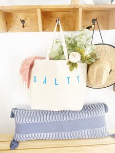 "The SALTY Oversized canvas tote bag is perfect for a trip to the beach! Also perfect to use as a reusable shopping bag, or everyday carryall. Available with text in several colors... check out the variations! This bag is made from 100% thick, sturdy canvas. AVAILABLE IN TWO SIZES * Large - 19.5\" x 13\" with a 4\" gusset *Jumbo - 23\" x 13\" with a 6\" gusset These bags are hand painted using non-toxic fabric paint. The technique used creates an attractive distressed appearance to the text that Bachelorette Party Tote Bags, Painted Canvas Bags, Girls Beach Trip, Canvas Beach Tote, Perfect Beach Bag, Canvas Beach Bag, Large Beach Bags, Mom Bags, Eco Friendly Bags