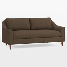 a brown couch sitting on top of a white floor