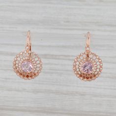 Gem: Natural Diamonds - 0.12 Total Carats, Round Brilliant Cut, F - G Color, VS2 Clarity - Natural Morganites - 0.98 Total Carats, Round Brilliant Cut, Pink Color Metal: 14k Rose Gold Weight: 3.3 Grams Stamps: 14k Closure: Hook Posts & Lever Backs Measurements: 21 x 12.8 mm Each piece is thoroughly examined and refinished as needed by our professional jewelers, graded by our in-house GIA (Gemological Institute of America) Graduate Gemologist, and inspected for quality before being carefully Pierced Round Rose Gold Diamond Earrings, Mens Custom Jewelry, Diamond Halo Earrings, Halo Diamond Earrings, Morganite Diamond, Filigree Jewelry, Halo Earrings, Recycled Jewelry, Heart Pendant Diamond