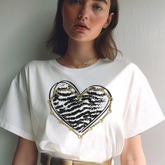 "Zebra Print Heart Shirt Retro Love Heart Shirt Gold Chain Tee Valentines Shirt Valentines Day Gift Valentine Shirt Jewelry Lover Gift Wife ♡ ITEM SPECIFICATIONS  ------------------------------------------- ❥ Stanley/Stella t-shirt - 100% organic ring-spun cotton ❥ Fabric weight: 5.3 oz/yd² (180 g/m²) ❥ Single jersey ❥ Medium fit ❥ Set-in sleeves ❥ 1 × 1 rib at collar ❥ Self-fabric neck tape ❥ Side seam construction for a structured look tailored fit that's flattering on the body. ❥ The fabric of this product is certified by GRS (Global Recycled Standard), OCS (Organic Content Standard), and GOTS (Global Organic Textile Standard) ❥The fabric of this product is OEKO-TEX Standard 100 certified and PETA-Approved Vegan ❥ Color representation is only as accurate as the web design process allows Shirt Jewelry, Zebra Shirt, Steampunk Victorian, Gifts Mom, Victorian Vintage, Family Necklace, Valentine Shirt, Gift Valentine, Heart Shirt