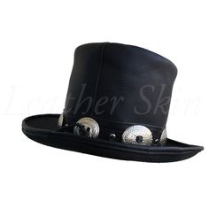 Make a chic style statement with Leather Skin shop’s Top hat. This hat is made from genuine leather (cowhide), giving it a smooth and luxurious feel. What’s more? The Top hat is comfortable to wear. Available in an affordable price, it makes for the perfect accessory to any outfit. Some of the things that set this hat apart: The band of the top hat is lined with metallic embellishments, giving it a fancy and attractive look. The flat crown of the hat and the slightly curved brim adds to the sophistication and class. It is available in many various sizes, and you can choose the one that best fits you. The high-quality full-grain leather adds to its durability and longevity. Intricate stitching, extensive detailing, and unique design – this is what makes this hat a wardrobe essential. Add on Curved Brim Leather Hat With Leather Backing, Leather Top Hat With Curved Brim For Rodeo, Adjustable Leather Top Hat With Curved Brim, Leather Flat Brim Hat With Leather Lining, Leather Hat With Curved Brim For Riding, Leather Riding Hat With Curved Brim, Leather Curved Brim Riding Hat, Western Black Leather Top Hat, Western Leather Top Hat With Short Brim