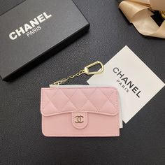 Luxurious Chanel Design: The wallet card holder features Chanel's signature elegance, showcasing the brand's iconic aesthetic. This timeless design adds a touch of sophistication and luxury to any ensemble. Premium Genuine Leather: Crafted from high-quality genuine leather, this wallet card holder provides a luxurious texture and exceptional durability. The leather construction ensures a long-lasting, stylish accessory. Secure Zipper Closure: The wallet is equipped with a secure zipper closure, ensuring that your cards and cash are safely stored. The zipper adds an extra layer of protection, preventing accidental loss of contents. Multiple Card Slots: Designed with multiple card slots, this wallet offers ample space for organizing your credit cards, IDs, and other essential items. The orga Card Holder Wallet Aesthetic, Iconic Aesthetic, Cute Luggage, Chanel Design, Zippers Fashion, Luxury Phone Case, Genuine Leather Wallets, Chanel Paris, Essential Items