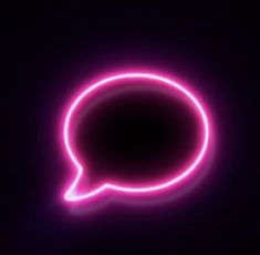 a neon pink speech bubble on a black background with the light reflecting off it's side