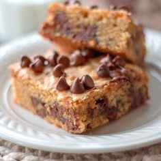 two pieces of chocolate chip cookie bars on a plate