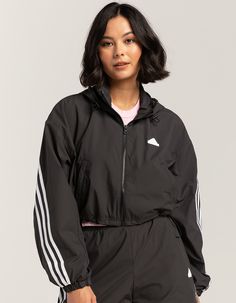 Adidas Future Icons 3-Stripes Windbreaker Jacket. On Grey Days, Give This Adidas Windbreaker A Run Out. Sturdy Yet Light, It Slips On Easily At The First Hint Of Blustery Weather. The Loose Fit Allows For Warm Layers Underneath. Full Zip With Drawcord-Adjustable Hood. Zippered Side Pockets. Silicone Adidas Logo On Left Chest. Cropped Length. Adjustable Toggles At Hem. 100% Recycled Polyester. Machine Wash. Imported. Model Is Wearing A Size Small. Model Measurements:height: 5'8" Bust: 32"waist: 2 Adidas Cropped Jacket, Adidas Hooded Windbreaker With Three Stripes, Adidas Athleisure Outerwear With Three Stripes, Adidas Sporty Windbreaker With Three Stripes, Functional Hooded Outerwear With Three Stripes, Adidas Functional Windbreaker With Three Stripes, Spring Adidas Logo Windbreaker In Athleisure Style, Spring Adidas Athleisure Windbreaker With Logo, Sportswear Windbreaker With Three Stripes