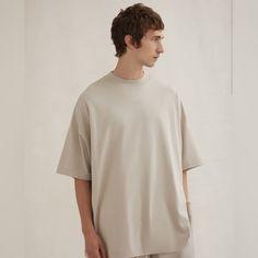 New With Tags. The Essentials Tee Shirt Returns To A Classic Crew Neckline While Maintaining The Relaxed Proportions In The Body And Sleeves. The Essentials Fear Of God Logo Is Sized Subtly In A Rubberized Soft-Touch Applique. A Fear Of God Rubberized Label Is At The Back Collar. Beige Relaxed Fit Plain T-shirt, Beige Short Sleeve T-shirt For Loungewear, Basic Khaki Short Sleeve Tops, Khaki Relaxed Fit Basic Tops, Basic Beige Crew Neck Top, Short Sleeve Cotton T-shirt In Neutral Color, Oversized Beige T-shirt For Loungewear, Beige Relaxed Fit Plain Top, Beige Cotton Shirt For Loungewear