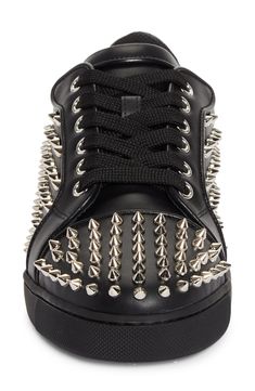 Gleaming metallic cone studs spike the upper of a leather low-top sneaker brightened up with a red logo-debossed tread. Lace-up style Wipe with a soft, dry cloth and store in a dust bag Leather upper/leather and textile lining/synthetic sole Made in Italy Streetwear Lace-up Sneakers With Rhinestone Rivets, Low-top Sneakers With Rhinestone Rivets For Streetwear, Black Studded Low-top Sneakers, Low-top Leather Sneakers With Studs, Punk Low-top Sneakers With Spikes, Designer Studded Low-top Sneakers, Luxury Studded Lace-up Sneakers, Studded Low-top Sneakers For Streetwear, Low-top Studded Sneakers For Streetwear