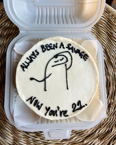 a cake in a plastic container that says always been a snake, not you're 29