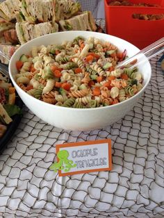 a bowl of pasta salad on a table