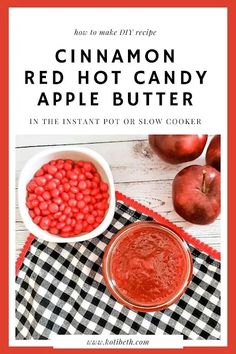 red hot candy in a bowl next to an apple on a checkered table cloth