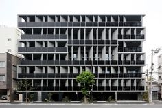 an apartment building with multiple balconies on the side