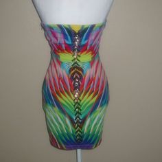 Get Ready To Turn Heads With This Stunning Bebe Mini Dress! The Strapless Design Is Perfect For Showing Off Your Shoulders, While The Sweetheart Neckline Adds A Touch Of Femininity. The Tropical Multicolor Print Is Perfect For Summer, And The Chain And Lacing Detail Down The Back Adds A Bit Of Edginess To The Look. Made Of A Polyester Blend, This Dress Is Comfortable And Perfect For Any Occasion. Whether You're Going On Vacation Or Attending A Party, This Dress Is A Must-Have. It's Available In Strapless Multicolor Mini Dress For The Beach, Multicolor Strapless Dress For Night Out, Chic Fitted Multicolor Strapless Dress, Multicolor Strapless Mini Dress For Club, Multicolor Summer Bodycon Dress For Evening, Multicolor Strapless Bodycon Dress For Night Out, Multicolor Strapless Bodycon Party Dress, Multicolor Fitted Strapless Dress, Elegant Fitted Multicolor Strapless Dress