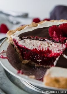 a chocolate raspberry pie with one slice missing