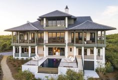 an aerial view of a large house with a pool