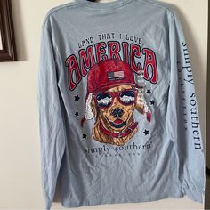 Super Cute America Themed Simply Southern Long Sleeved Tee, With The Cutest Little Pup On The Back. Size Small New With Tags Patriotic Long Sleeve Tops For Summer, Patriotic Long Sleeve Summer Tops, Red Patriotic Top For Fall, Patriotic Blue Tops For Fall, Patriotic Blue Cotton Tops, Blue Cotton Patriotic Tops, Simply Southern Outfits, Hunting Outfits, Future Man