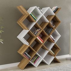 the bookshelf is made out of wood and has several shelves on each side