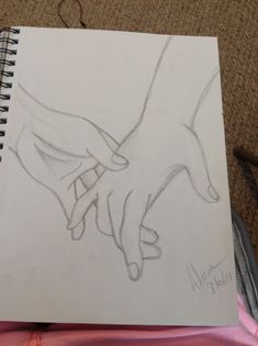 a drawing of two hands holding each other