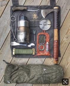 an assortment of tools laid out on top of a bag