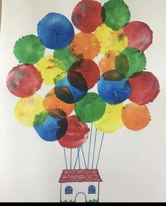 a drawing of a house with colorful umbrellas in the shape of a bunch of balloons