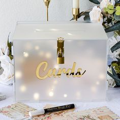 a white box with the word cardio written on it next to some flowers and candles