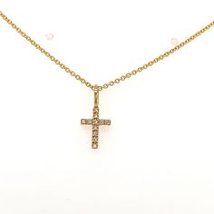 DESCRPITION Simple Gold Cross Necklace Metal: 14k yellow gold Diamond Information: Quatity: 11 Diamonds: .04ct Color: H Clarity:SI1-SI2 ABOUT Ederra | Release Your Inner Goddess Gold is one of the oldest metals on this planet. It symbolizes humankind's journey to illuminate and refine oneself. It exerts positive energy and clarity to help you get to the ultimate level of euphoria. Welcome to Ederrá, where each piece is made with love. Browse through an assortment of timeless, elegant, dainty gol Yellow Gold Cross Pendant For First Communion, Yellow Gold Cross Pendant Necklace For First Communion, Yellow Gold Cross Pendant For Baptism, Yellow Gold Cross Necklaces For Baptism, Yellow Gold Baptism Cross Pendant Jewelry, Yellow Gold Cross Necklace With Diamond Accents For Gift, Yellow Gold Diamond Cross Necklace Gift, Diamond Cross Necklace In Yellow Gold As Gift, Classic Cross Pendant Jewelry For First Communion