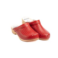 Wooden clogs with perforated leather in red is  a perfect blend of style, comfort and sustainability. Handmade by a small company, these clogs are crafted with care, using high-quality materials to ensure durability and elegance. || Features || Material: The upper material of these clogs is made from real leather. The sole is crafted from real alder wood, adding a touch of natural beauty to the design. Sewn synthetic sponge on the instep and Upper Leather With Holes. Heel Height: Wooden Clogs fe Comfortable Closed Toe Clogs With Leather Sole, Red Casual Mules With Rubber Sole, Casual Red Clogs With Rubber Sole, Casual Red Mules With Rubber Sole, Red Slip-on Mules With Rubber Sole, Comfortable Red Summer Clogs, Red Mules With Rubber Sole For Spring, Casual Red Leather Clogs, Comfortable Red Clogs With Round Toe