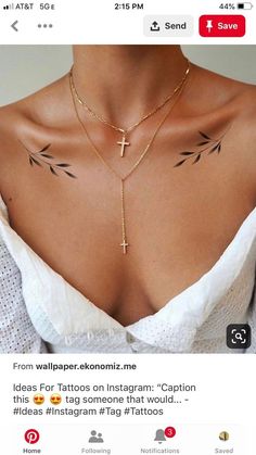 the back of a woman's chest with tattoos on it and an arrow in the middle