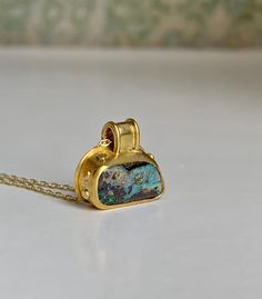 "Australian Boulder Opals in a unique 22k Gold ancient granulation setting.  This Opal is full of flashy color in matrix, photos and video taken in natural daylight so the multiple iridescent colors are shown true.  It's wrapped in an ancient stylized 22k Gold bezel with wide bail and granulation.  A unique addition to my \"Ancient Illusion\" Opal and 22k Gold pendant collection. A perfect size at 15mm wide and 17mm tall." 22k Gold Necklace, Weird Jewelry, Australian Boulder Opal, Cabochon Pendant, Brass Jewelry, Boulder Opal, Opal Jewelry, 22k Gold, Glasses Accessories