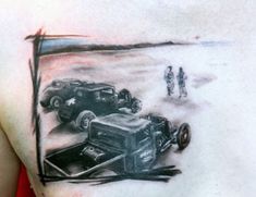 a man's chest with an old timey car and truck tattoo on it