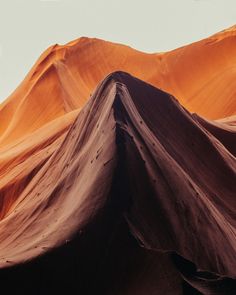 the mountains are covered in sand and have very thin ridges on them, as seen from below