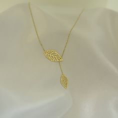 "\"Double Leaf Gold Necklace | Mother of Nature, Leaves of Tree Golden Pendant | Outline Hollow Leaves | Elegant Design | 14K Solid Rose Gold\" ∙ P R O D U C T I O N ∙ ‣ All of our products are handmade and made to order ‣ All of our items are 14K real gold. We do not carry any gold filled, gold plated, or gold vermeil items. Also there are no other metals used so all items are hypoallergenic. ‣ Raw materials are coming from historical gold and jewelry market of Istanbul Grand Bazaar. The Grand Adjustable Diamond Cut Necklace For Gifts, White Gold Lariat Necklace With Clavicle Chain For Gift, Fine Jewelry Adjustable Necklace For Anniversary, White Gold Pendant Lariat Necklace Gift, White Gold Pendant Lariat Necklace As A Gift, 14k Gold Lariat Necklace As A Gift, White Gold Lariat Necklace As Fine Jewelry Gift, Adjustable Yellow Gold Necklace For Anniversary, Luxury Lariat Necklace With Delicate Chain For Gift