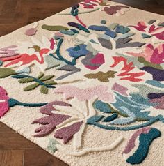 an area rug with flowers and leaves on it