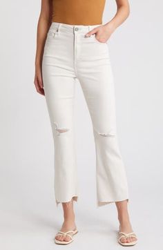 Laid-back and perfect for casual days, these cropped high-waist wide-leg jeans feature raw step hems and shredded knees for edgier styling. 27" inseam; 11 1/2" front rise Zip fly with button closure Five-pocket style 57% cotton, 35% Tencel® lyocell, 6% polyester, 2% spandex Tencel lyocell is a more-sustainably produced fiber made with closed-loop processing Machine wash, tumble dry Imported Ripped Cropped Jeans For Fall, Trendy Wide Leg Flare Jeans With Frayed Hem, White High Rise Flare Jeans With Frayed Hem, White High-rise Flare Jeans With Frayed Hem, Chic Distressed Flare Jeans For Summer, White High Waist Flare Jeans With Frayed Hem, White High-waist Flare Jeans With Frayed Hem, Chic Ripped Cropped Leg Bottoms, High Rise White Cropped Jeans With Frayed Hem