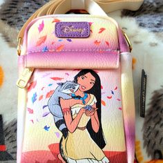 Disney Princess Pocahontas Crossbody Bag. Super Nice With A Large Zipper Compartment And A Smaller Zipper Compartment On The Front. It Has An Adjustable Strap And Is Made Of A Soft Leather. Disney Style Shoulder Bag With Removable Pouch, Crossbody Shoulder Bag For Disney Trips, Loungefly Collection, Disney Princess Pocahontas, Princess Pocahontas, Disney Canvas, Adjustable Strap Bag, Dooney And Bourke Disney, Disney Bags