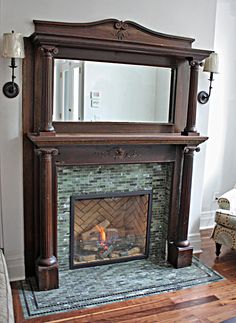 a living room with a fire place and mirror