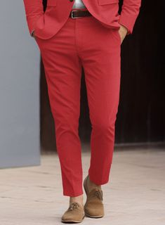 If you were ever going to refer to a suit as a 'party suit,' our Scabal Red Cotton Stretch Suit would definitely fit the bill. Crafted from a cotton blend with elastane for ease of movement, it features a solid texture with a bold and sparkling red color that catches the light of disco balls, and red carpet camera flashes alike. So all you'll need to do is practice your best smize.  Look Includes    Scabal     Red     Cotton     Stretch  Fabric  Two Button Jacket Style  Notch Lapel   Horn   Roya Red Fitted Suits For Business Casual, Red Fitted Suit For Business Casual, Red Fitted Business Casual Suit, Red Slim Fit Suits For Semi-formal Occasions, Red Fitted Suits In Suiting Fabric, Fitted Red Suit In Suiting Fabric, Classic Tailored Red Pants, Tailored Classic Red Pants, Red Cotton Party Bottoms