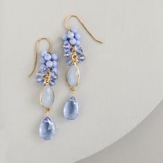 Dripping in gems, these long drop earrings are made with a dark blue chalcedony bezel and sky blue quartz gemstones.- 2.5" long- French hooks- 14k gold plated .925 fine Italian sterling silver- Made in the USA in our NYC studio- Packaged in a gift box- Free shipping on US ordersHandmade to last. Our unique gold plating technique makes our jewelry tarnish resistant. The nature of natural gemstones makes each style one-of-a-kind. Bridesmaids Outfits, Gemstone Earrings Gold, Gemstone Drop Earrings, Peridot Earrings, Unique Nature, Blue Quartz, Cluster Earrings, Blue Chalcedony, Drop Earring